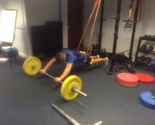 man performing strength exercise